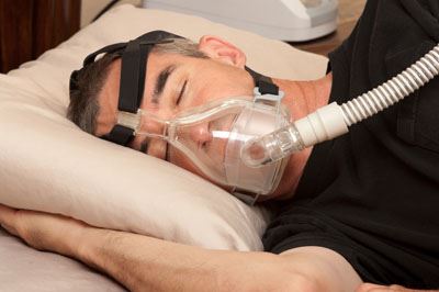 man with CPAP machine